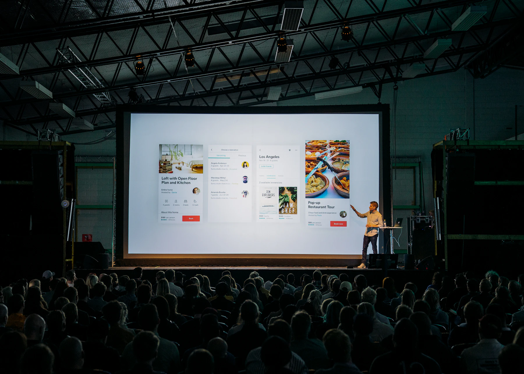A speaker presenting to a large audience